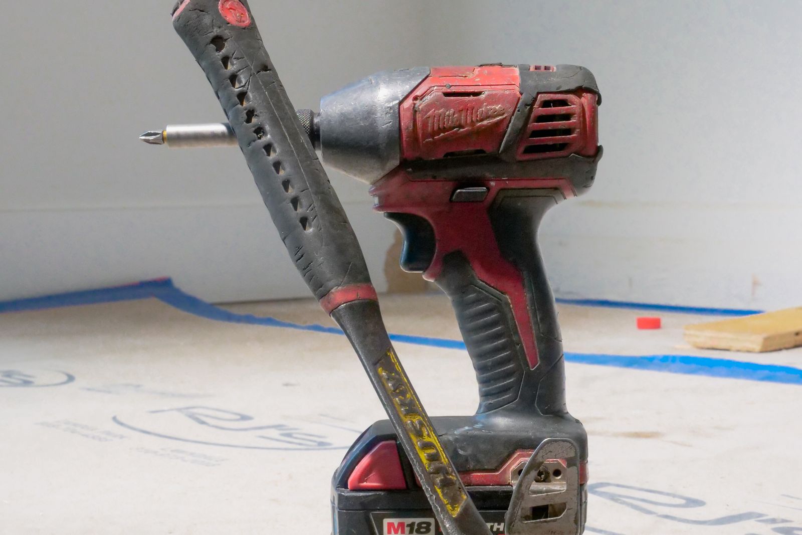 Workbench with drill, converters and wiring for a 12V DC conversion project