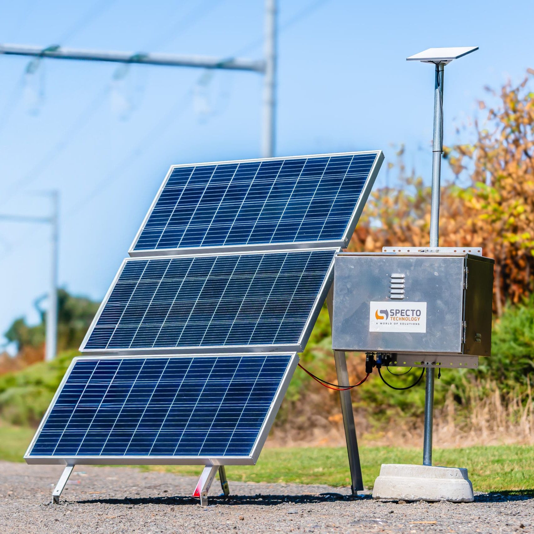 Foldable solar panels charging equipment at an off-grid campsite